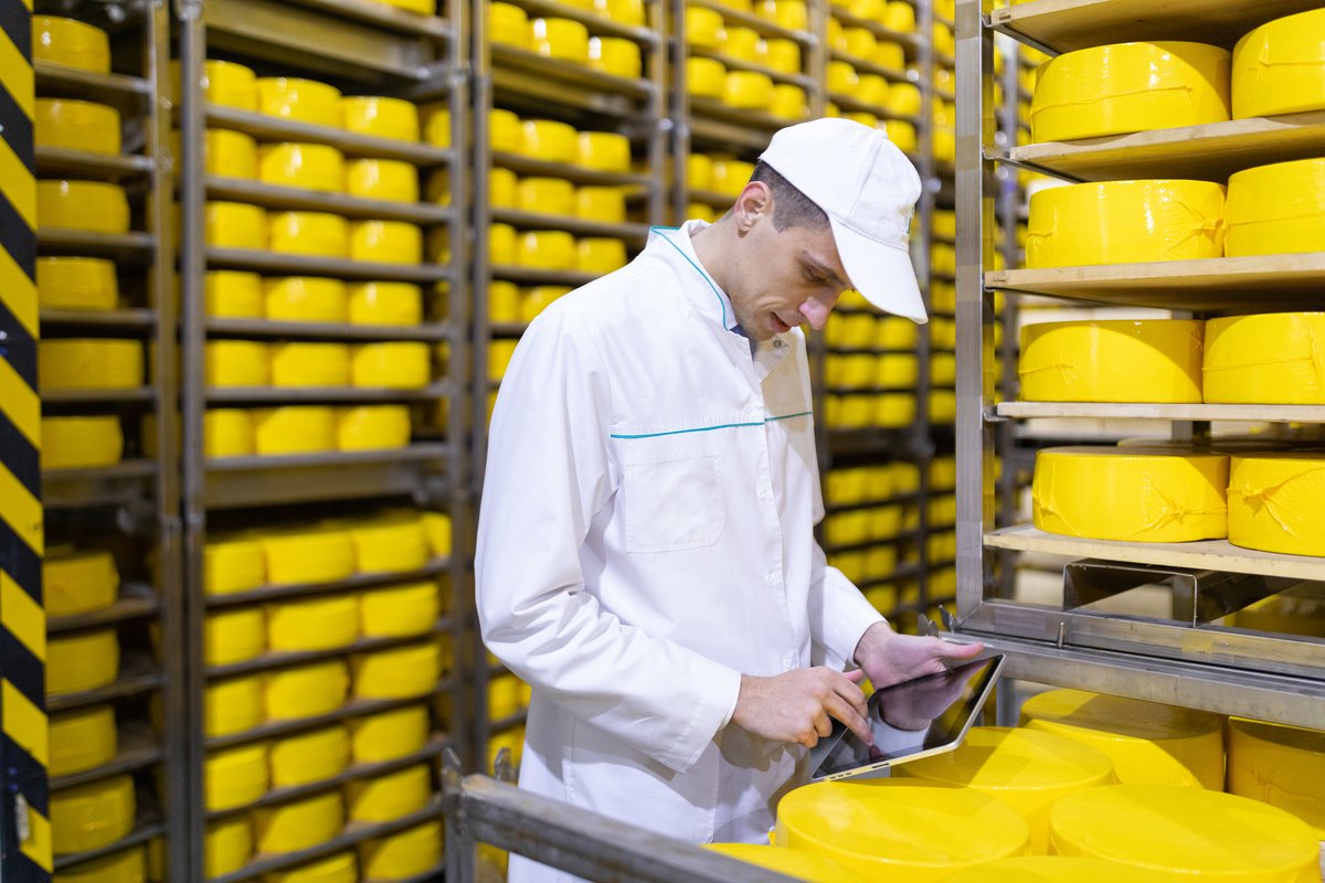 technologist-white-robe-holding-tablet-records-stands-near-shelves-with-cheeses-production-cheese-products-man-cheese-shop.jpg technologist-white-robe-holding-tablet-records-stands-near-shelves-with-cheeses-production-cheese-products-man-cheese-shop.jpg